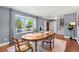 Formal dining room has a large window seat and a view of the landscaped front yard at 6975 S Wadsworth Ct, Littleton, CO 80128