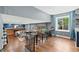Spacious living room featuring hardwood floors and open access to kitchen and dining areas at 6975 S Wadsworth Ct, Littleton, CO 80128