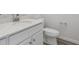 Well-lit bathroom featuring a modern vanity with marble countertop and a standard toilet at 487 Interlocken Blvd # 409, Broomfield, CO 80021