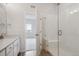 Bathroom features modern shower with a glass door, vanity, and sink with lots of natural light at 487 Interlocken Blvd # 409, Broomfield, CO 80021