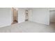 Light-filled bedroom with plush carpeting and easy access to the ensuite bathroom and walk-in closet at 487 Interlocken Blvd # 409, Broomfield, CO 80021