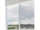 Bright window offering exterior views of other houses in the neighborhood on a clear day at 487 Interlocken Blvd # 409, Broomfield, CO 80021