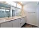 Modern bathroom featuring double vanity, large mirror, and sleek fixtures in neutral tones at 3404 W 18Th Ave, Denver, CO 80204