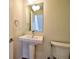 Cozy half bath with a pedestal sink, toilet and modern fixtures at 3404 W 18Th Ave, Denver, CO 80204