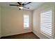 Bedroom with window shutters and a modern ceiling fan at 3404 W 18Th Ave, Denver, CO 80204