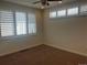 Sunlit bedroom features neutral walls, carpeted floor, and large windows with shutter blinds at 3404 W 18Th Ave, Denver, CO 80204