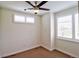 Cozy bedroom with carpeted floors, a ceiling fan, and bright windows with shutter blinds at 3404 W 18Th Ave, Denver, CO 80204