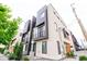 Modern townhome showcasing sleek architectural design and contemporary color palette on a sunny day at 3404 W 18Th Ave, Denver, CO 80204