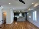This living room features an open floor plan connected to a modern kitchen and hardwood floors at 3404 W 18Th Ave, Denver, CO 80204