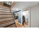 Basement featuring a staircase, living area and closet with stacked washer and dryer at 249 S Lincoln St, Denver, CO 80209
