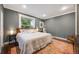 Inviting bedroom with hardwood floors, two closets, and natural light from the window at 249 S Lincoln St, Denver, CO 80209