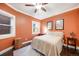 Charming bedroom with a ceiling fan, beautiful butterfly wall art, and wood floors at 249 S Lincoln St, Denver, CO 80209