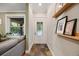 Welcoming entryway with slate tile flooring, decorative front door, and stylish decor at 249 S Lincoln St, Denver, CO 80209