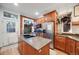 Stylish kitchen with stainless steel appliances, granite countertops, and a convenient center island at 249 S Lincoln St, Denver, CO 80209