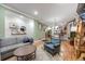 Open living space with hardwood floors, exposed brick, stylish decor, and a spacious layout at 249 S Lincoln St, Denver, CO 80209