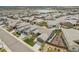 Aerial view of a neighborhood showcasing well-maintained homes and a nearby lake at 11168 Sweet Cicely Dr, Parker, CO 80134