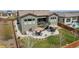 Sprawling backyard featuring a concrete patio with dual seating areas, complemented by an expansive lawn at 11168 Sweet Cicely Dr, Parker, CO 80134