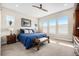 Serene bedroom with neutral tones, plush carpeting, and large windows offering plenty of natural light at 11168 Sweet Cicely Dr, Parker, CO 80134