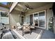 Inviting covered patio with comfortable seating, a ceiling fan, and a grill, perfect for outdoor entertaining at 11168 Sweet Cicely Dr, Parker, CO 80134