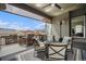 Outdoor living space featuring a grill, comfortable seating, and a retractable awning for shade at 11168 Sweet Cicely Dr, Parker, CO 80134
