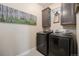 Modern laundry room featuring new washer and dryer and ample cabinet space at 11168 Sweet Cicely Dr, Parker, CO 80134