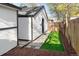 The backyard features wood fencing, turf, and a detached garage at 1755 Ingalls St, Lakewood, CO 80214