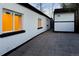 The backyard features stone pavers and a detached garage at 1755 Ingalls St, Lakewood, CO 80214