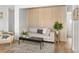 Stylish living room featuring a comfortable sofa and textured wood accent wall at 1755 Ingalls St, Lakewood, CO 80214