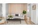 Cozy living room featuring a stylish accent wall, neutral-toned sofa, and a modern coffee table at 1755 Ingalls St, Lakewood, CO 80214