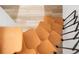 Unique design of floating wooden stairs adds a modern touch to the interior at 1755 Ingalls St, Lakewood, CO 80214