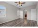 Empty bedroom featuring wood-look flooring and an ensuite bathroom at 12941 Grant W Cir # C, Thornton, CO 80241