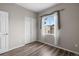 Bedroom with hard surface floors, a closet with sliding doors, and a window at 12941 Grant W Cir # C, Thornton, CO 80241