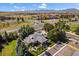 Breathtaking aerial view showcases community pool and manicured landscaping with mountain backdrop at 710 Copper Ln # 102, Louisville, CO 80027