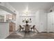 Dining area featuring stylish light fixture and chairs adjacent to the functional kitchen space at 710 Copper Ln # 102, Louisville, CO 80027