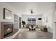 Bright living room featuring a cozy fireplace, and ample natural light from a large window at 710 Copper Ln # 102, Louisville, CO 80027