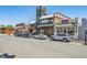 View of several restaurants including The Melting Pot and The Singing Cook, all lined up on a sunny street at 710 Copper Ln # 102, Louisville, CO 80027