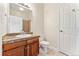 Clean bathroom with granite vanity, toilet, and shower, featuring modern fixtures and tile flooring at 277 N Broadway # 409, Denver, CO 80203