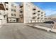 Apartment building exterior with balconies, parking, and garages, offering a convenient urban lifestyle at 277 N Broadway # 409, Denver, CO 80203