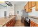 Kitchen features granite countertops, stainless steel appliances and wood cabinetry at 277 N Broadway # 409, Denver, CO 80203