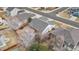 Aerial shot of a home with a patio, fenced yard, and mature landscaping at 17161 E Dewberry Dr, Parker, CO 80134