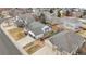 An aerial shot showcases the house with a 3-car garage and a well-maintained yard in a neighborhood at 17161 E Dewberry Dr, Parker, CO 80134