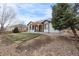Backyard featuring a modern pergola and patio and mature trees in a landscaped yard at 17161 E Dewberry Dr, Parker, CO 80134