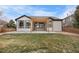 Backyard featuring a modern pergola, patio, manicured grass, and privacy fencing at 17161 E Dewberry Dr, Parker, CO 80134