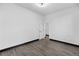 Bright bedroom featuring modern trim, neutral walls, and stylish grey vinyl flooring at 17161 E Dewberry Dr, Parker, CO 80134