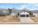 Beautiful home featuring a two-car garage, modern white paint, and gray roof at 17161 E Dewberry Dr, Parker, CO 80134