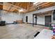 Spacious garage area with high ceilings, ample storage, and multiple access points for convenience and utility at 17161 E Dewberry Dr, Parker, CO 80134