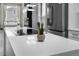 Kitchen island featuring quartz counters, a cooktop, and a cactus in a pot with stainless steel appliances at 17161 E Dewberry Dr, Parker, CO 80134