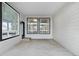 Rear patio with concrete floor, siding, and a black framed sliding glass door at 17161 E Dewberry Dr, Parker, CO 80134