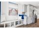 Dining nook featuring extra built in seating, with ample cabinetry and natural light at 5202 Reed St, Arvada, CO 80002