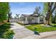 Charming single story home with a covered porch and a detached garage at 5202 Reed St, Arvada, CO 80002